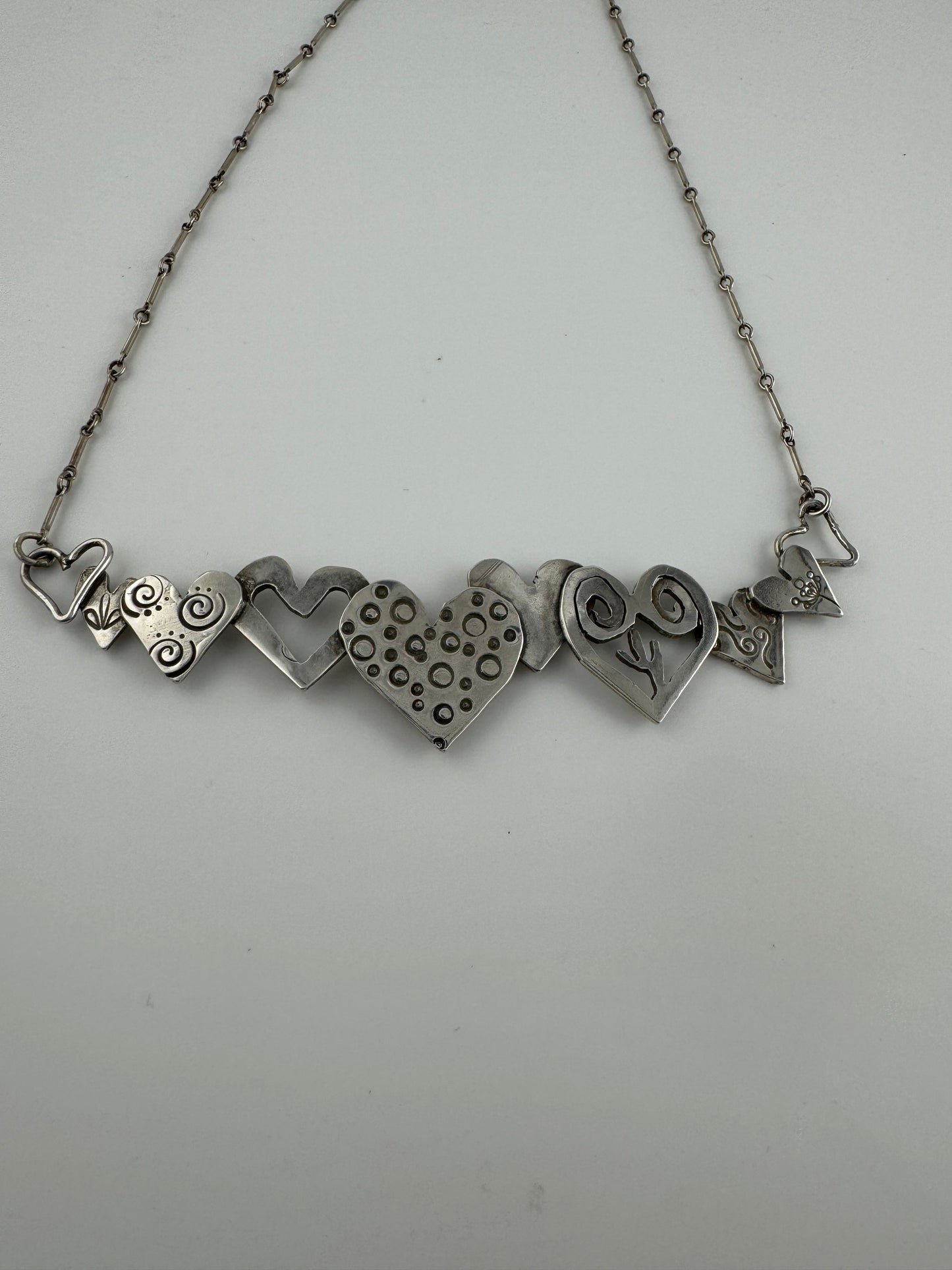 Silver bar of hearts necklace