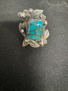 Silver ring with flowers and leaves