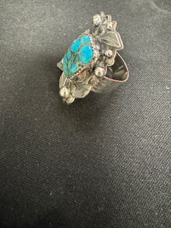 Silver ring with flowers and leaves