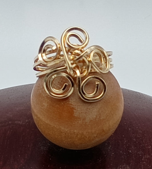 Gold swirl ring
