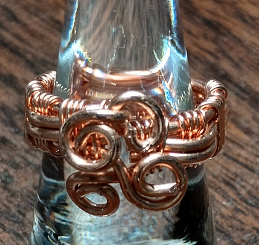 Hand woven copper ring.