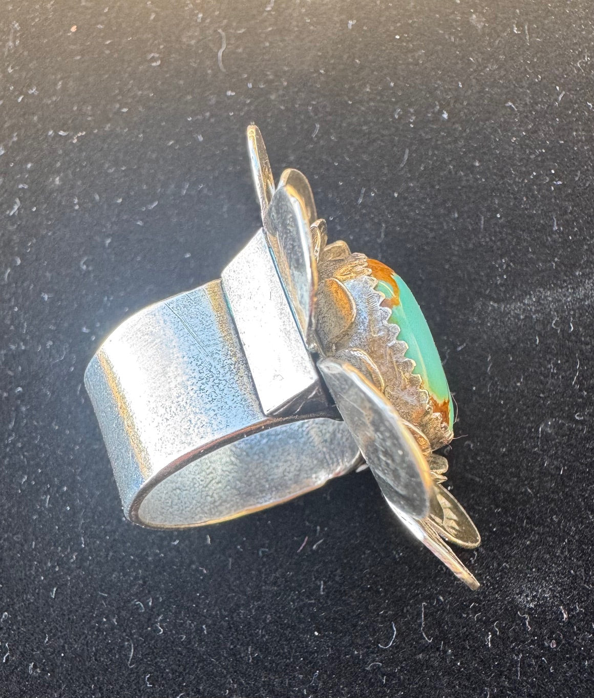 Silver flower with turquoise ring